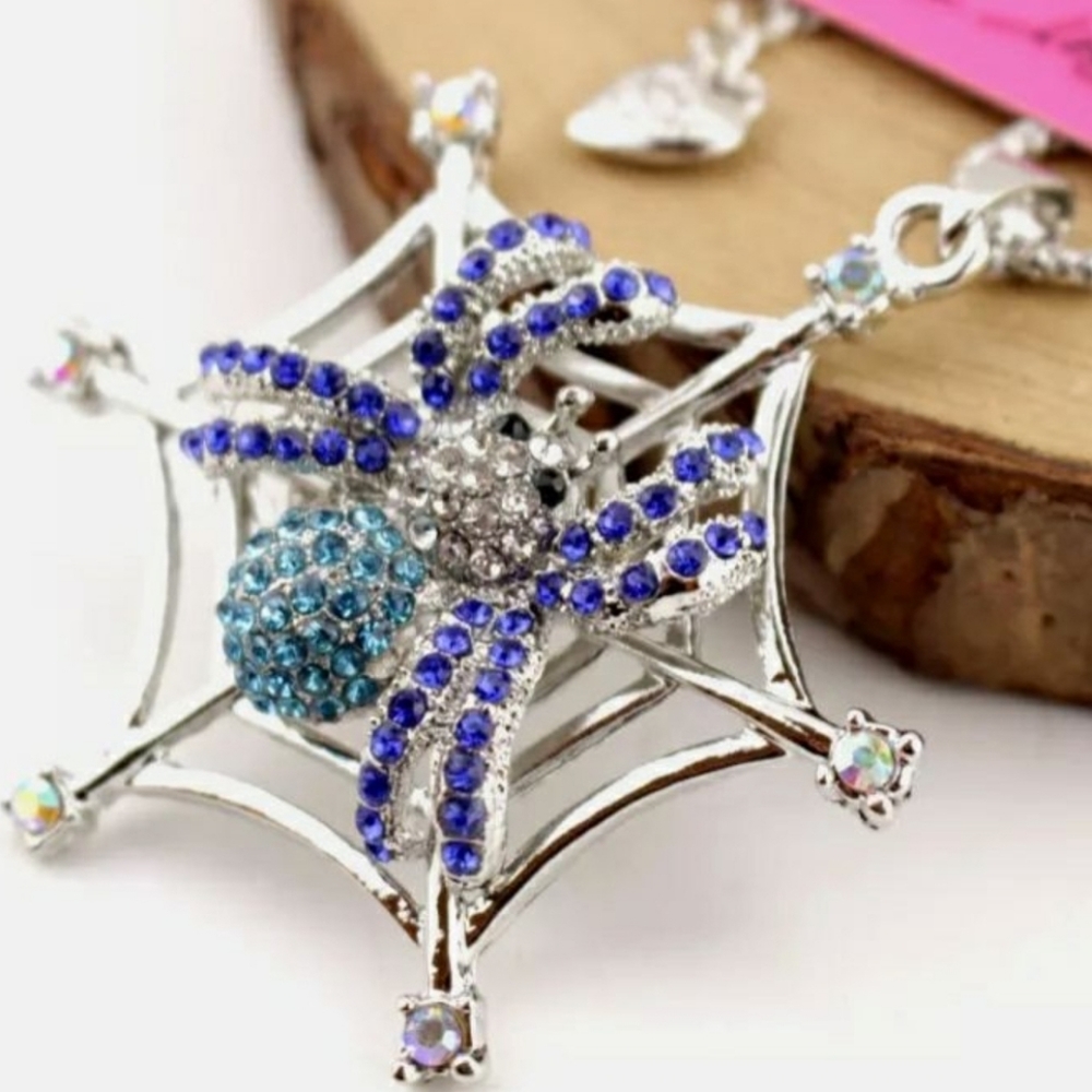 Silver plated blue and white crystal spider Web necklace